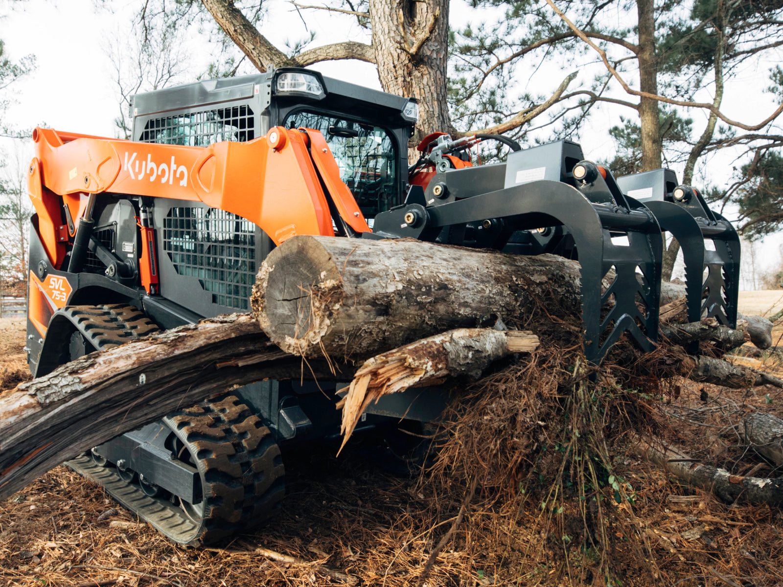 Root grapple attachment clearing brush